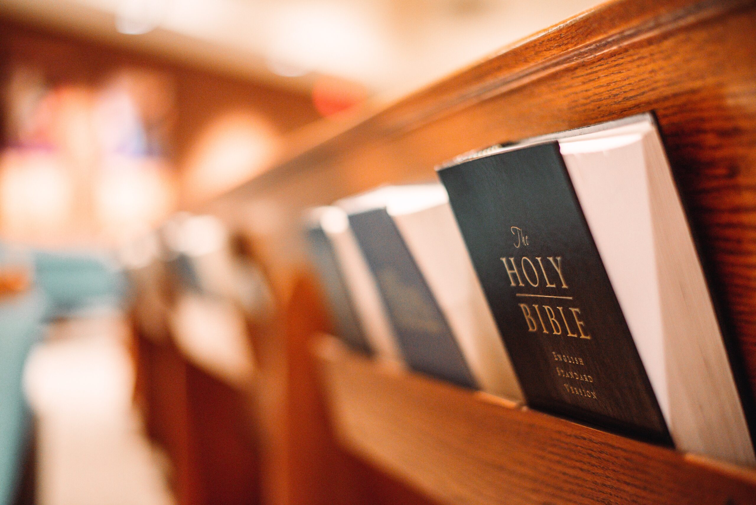 back of a church pew with american standard bibles